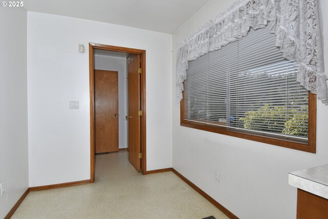 empty room with baseboards