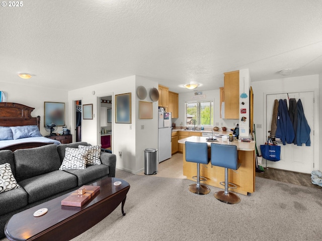 107 Sunset Blvd, Cannon Beach, OR 97110 - living area featuring light colored carpet and a textured ceiling