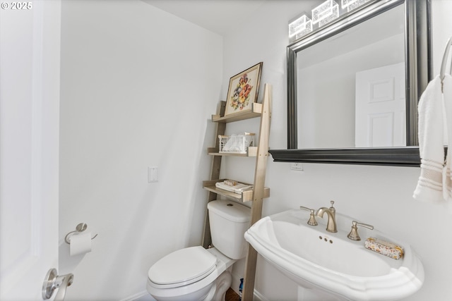 bathroom featuring sink and toilet