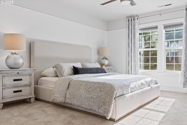 carpeted bedroom featuring ceiling fan