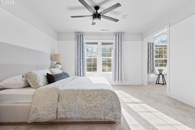 bedroom featuring ceiling fan and light carpet