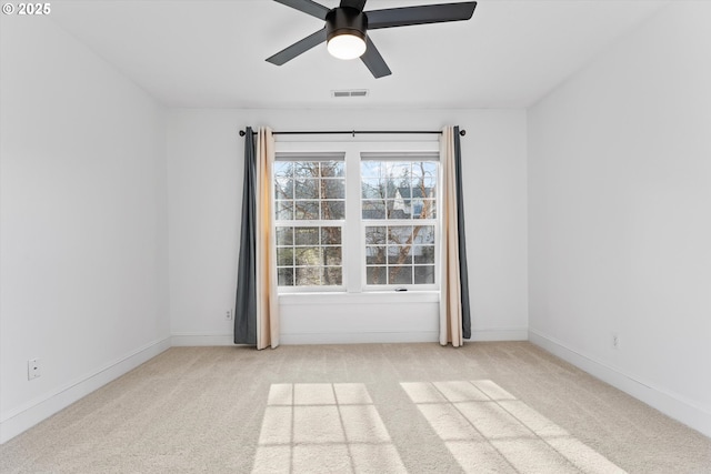 empty room with light carpet and ceiling fan