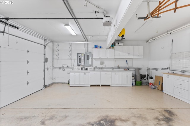 garage featuring a garage door opener and electric panel