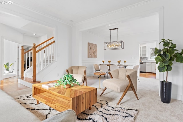 living room featuring crown molding, light colored carpet, and a notable chandelier