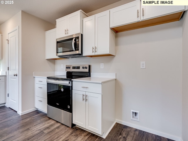 kitchen with stainless steel appliances, baseboards, dark wood-style flooring, white cabinets, and light countertops