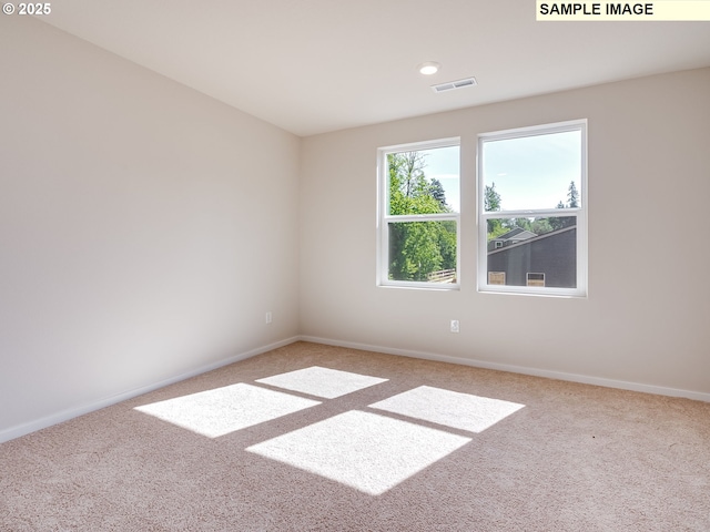 unfurnished room featuring carpet, baseboards, and recessed lighting