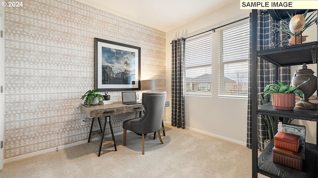 carpeted office featuring wallpapered walls and baseboards