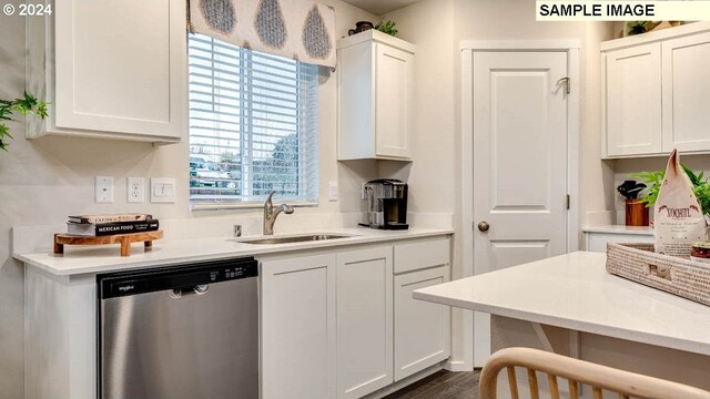 kitchen featuring white cabinetry, sink, a healthy amount of sunlight, and dishwasher