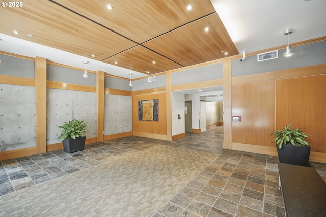building lobby featuring wood ceiling