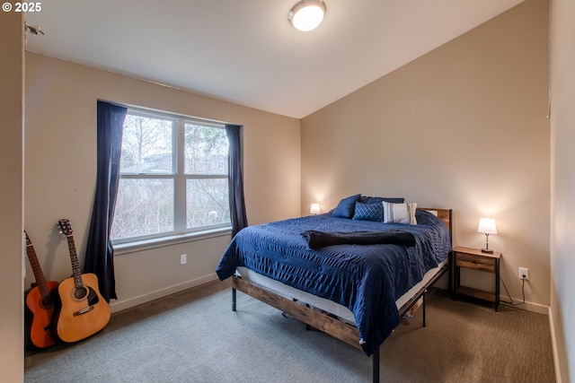 bedroom featuring baseboards, carpet floors, and vaulted ceiling