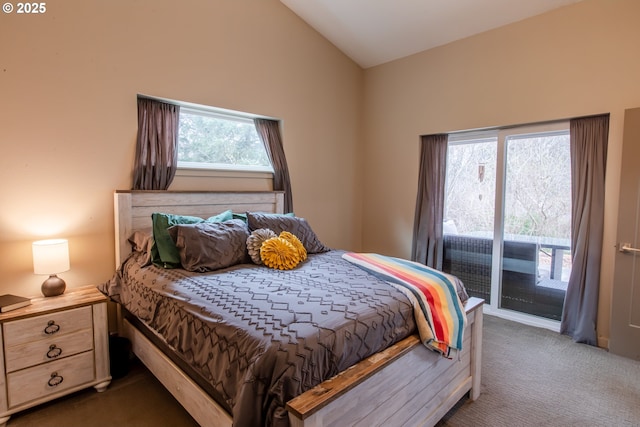 bedroom featuring lofted ceiling, access to outside, and carpet floors