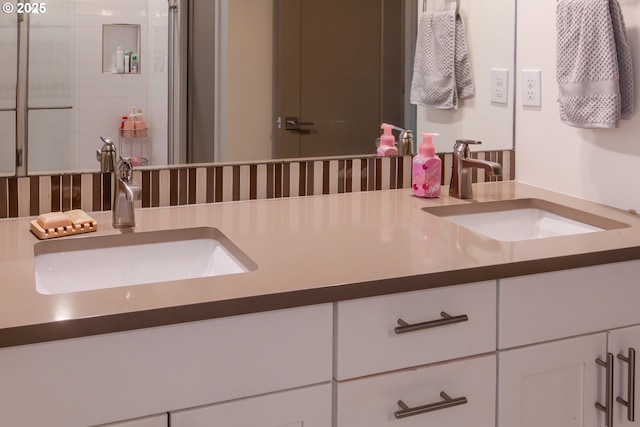 bathroom with double vanity and a sink