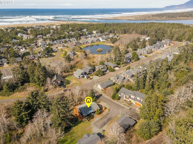 drone / aerial view with a residential view and a water view