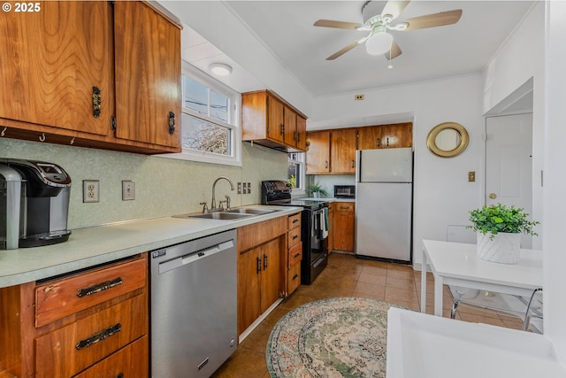 kitchen featuring light tile patterned flooring, sink, refrigerator, stainless steel dishwasher, and black range with electric stovetop