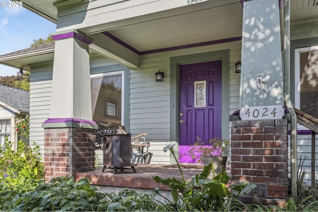 entrance to property with covered porch
