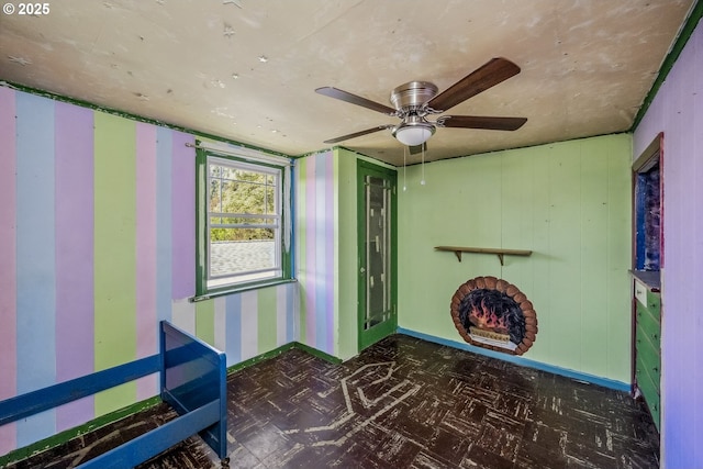 entryway with tile patterned floors, baseboards, and ceiling fan