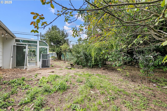 view of yard with a sunroom