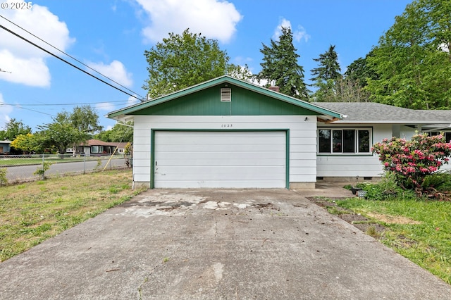 single story home featuring an attached garage, concrete driveway, crawl space, and roof with shingles