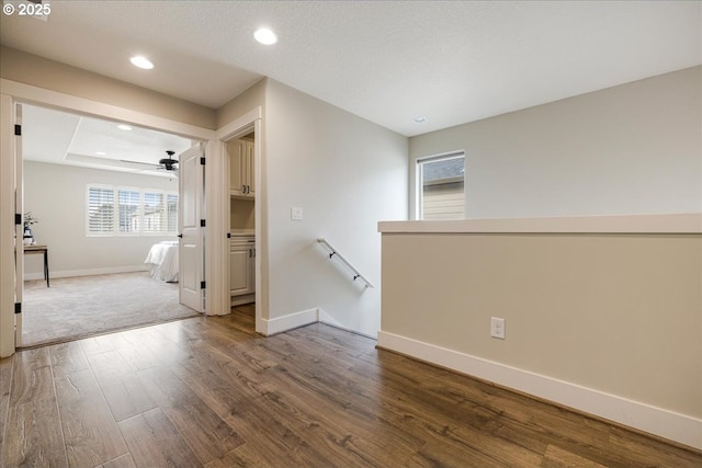 interior space featuring ceiling fan and hardwood / wood-style flooring