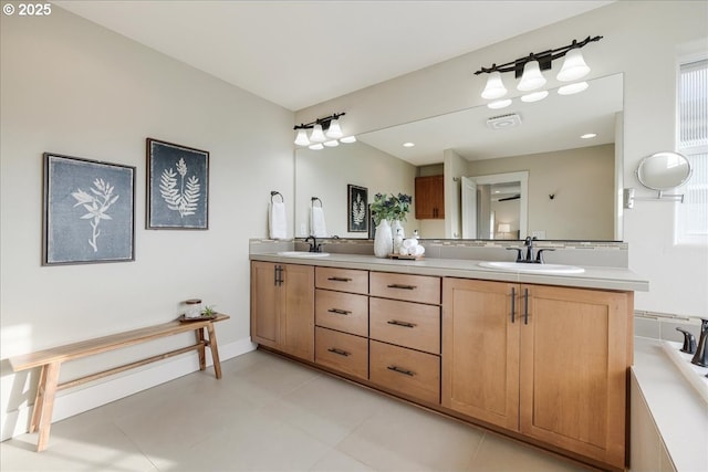 bathroom with tile patterned floors and vanity