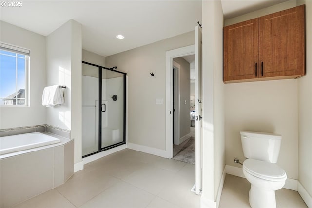 bathroom with tile patterned floors, separate shower and tub, and toilet