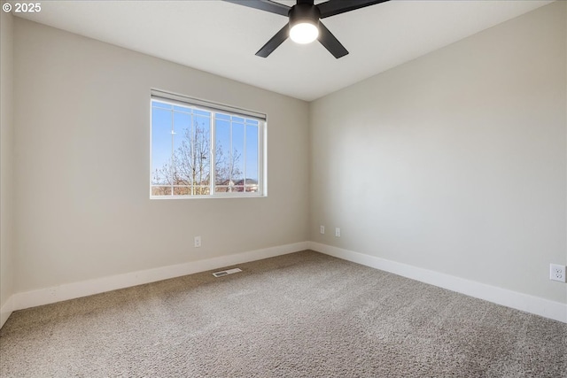 empty room featuring carpet floors and ceiling fan