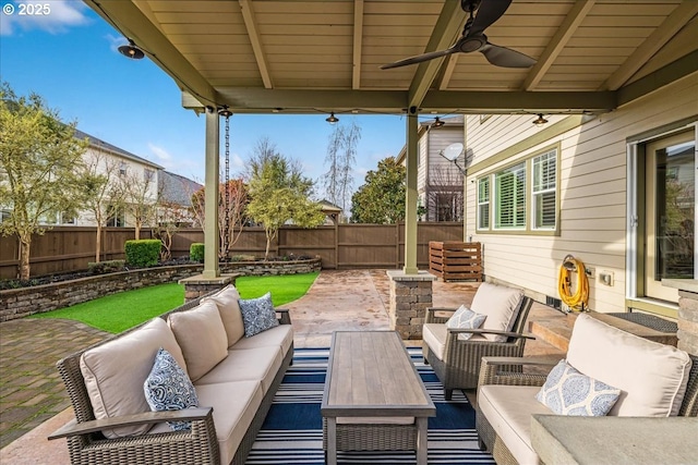 view of patio / terrace featuring ceiling fan and an outdoor living space