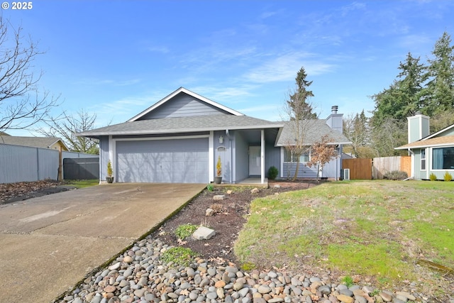 ranch-style house featuring a garage, driveway, a front yard, and fence