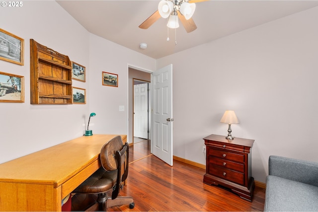 13130 Lookingglass Rd, Winston, OR 97496 - office featuring dark wood-type flooring, baseboards, and ceiling fan