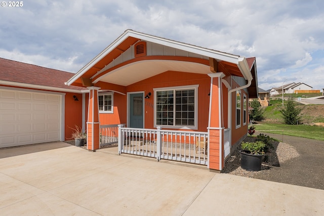13130 Lookingglass Rd, Winston, OR 97496 - view of front of property featuring driveway, a porch, and a garage