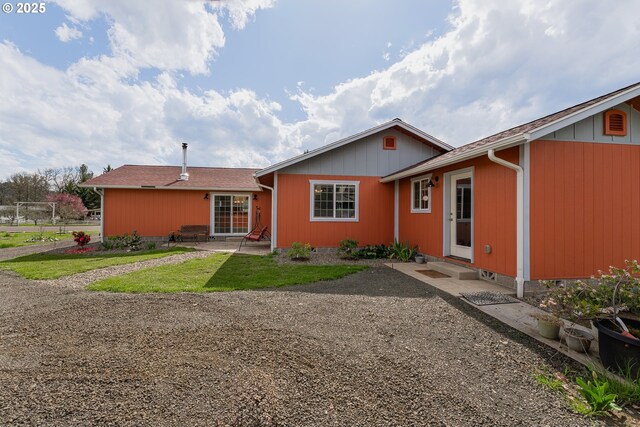 13130 Lookingglass Rd, Winston, OR 97496 - rear view of property featuring a patio, a yard, and entry steps