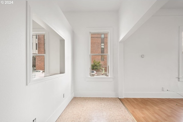 bonus room with light wood-type flooring