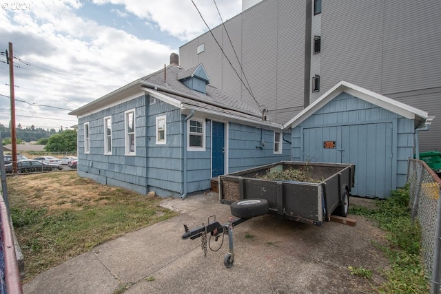 view of side of property featuring a yard