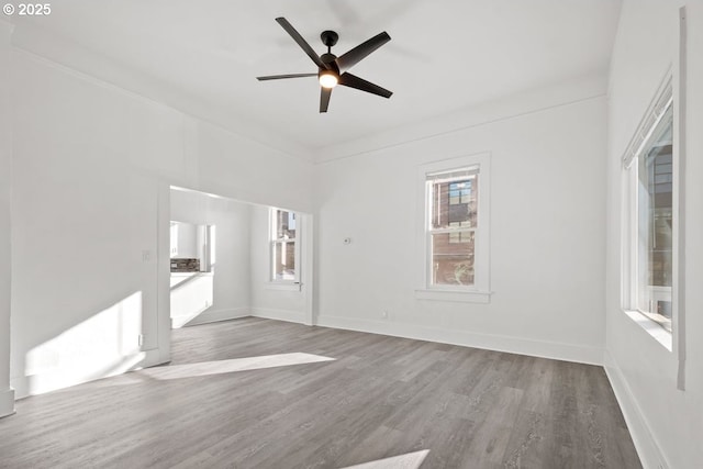 unfurnished living room featuring hardwood / wood-style floors and ceiling fan