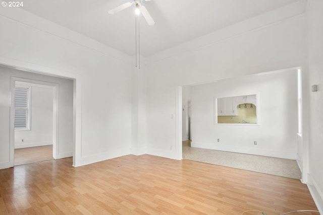 unfurnished living room featuring light hardwood / wood-style flooring and ceiling fan