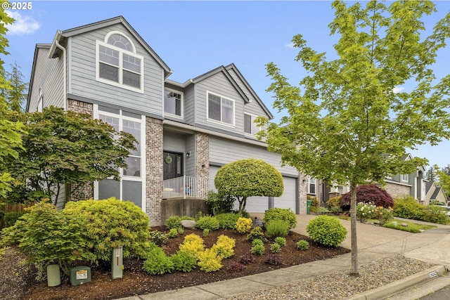 16205 SW Blackbird Dr, Beaverton, OR 97007 - view of property with a garage, brick siding, and concrete driveway