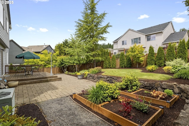 16205 SW Blackbird Dr, Beaverton, OR 97007 - view of patio featuring a vegetable garden, a wooden deck, and outdoor dining area