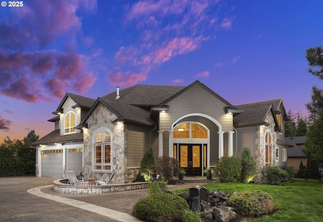 view of front of home featuring french doors and a garage