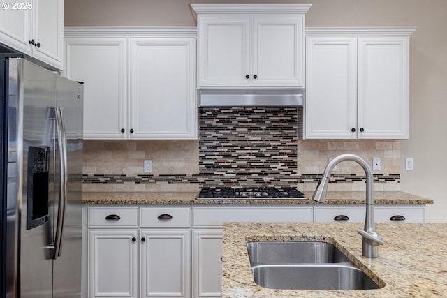 15997 NW Rossetta St, Portland, OR 97229 - kitchen with appliances with stainless steel finishes, a sink, white cabinetry, and tasteful backsplash