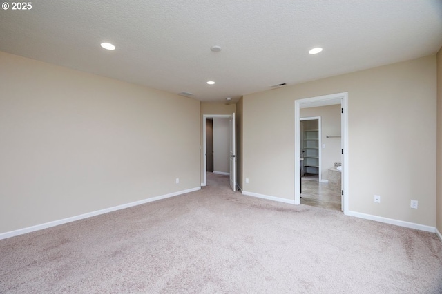 15997 NW Rossetta St, Portland, OR 97229 - unfurnished bedroom featuring light colored carpet, baseboards, and recessed lighting