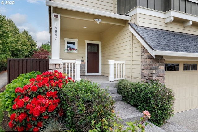 15997 NW Rossetta St, Portland, OR 97229 - property entrance featuring board and batten siding, stone siding, a shingled roof, and a porch