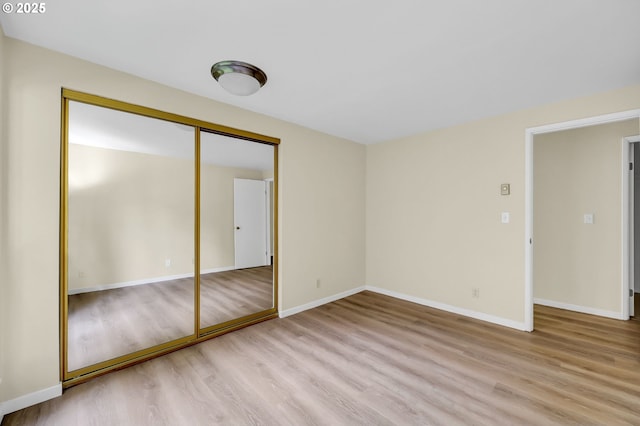 202 Trailside Loop, Eugene, OR 97405 - unfurnished bedroom with wood finished floors and a closet
