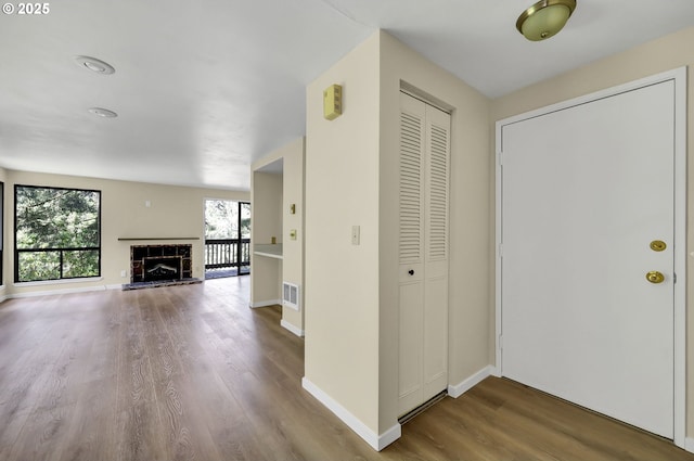 202 Trailside Loop, Eugene, OR 97405 - foyer entrance featuring wood finished floors and a fireplace with raised hearth