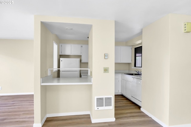202 Trailside Loop, Eugene, OR 97405 - kitchen with white appliances, wood finished floors, and white cabinets