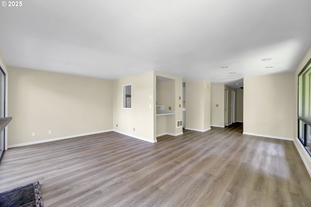 202 Trailside Loop, Eugene, OR 97405 - unfurnished living room featuring wood finished floors and recessed lighting