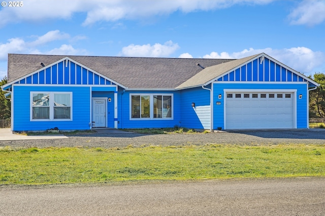 view of front of home featuring a garage and a front yard