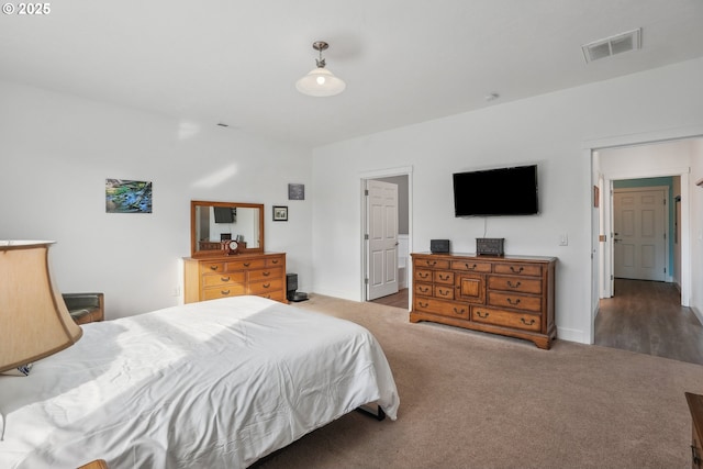 bedroom with dark carpet