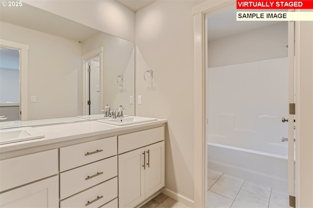 bathroom featuring bathtub / shower combination, vanity, and tile patterned flooring