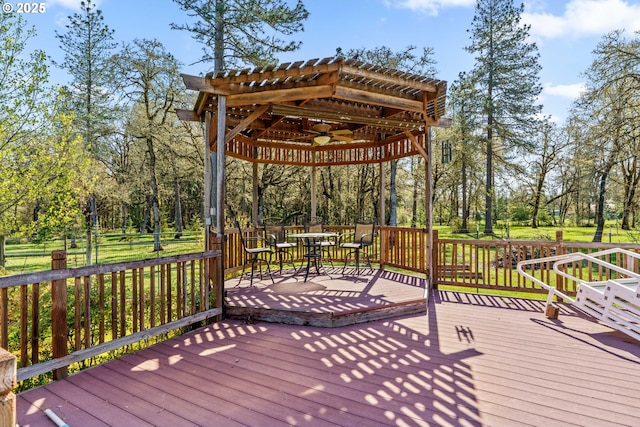deck featuring ceiling fan and outdoor dining area