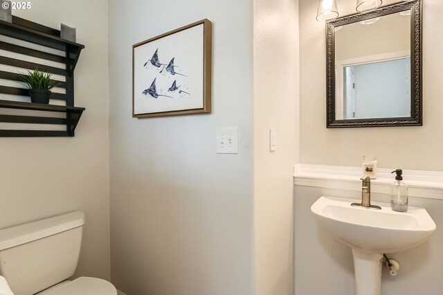 bathroom featuring a sink and toilet